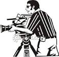 man positioning a video camera on a tripod royalty free clipart